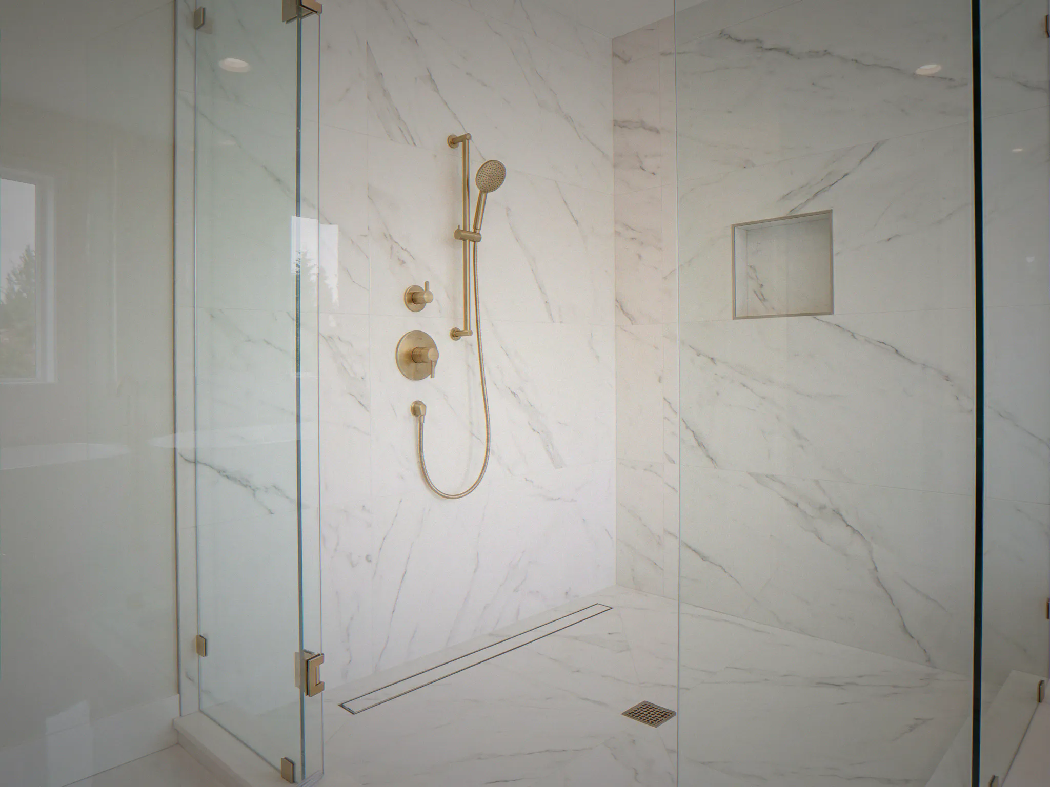 Custom mosaic tile accent niche in luxury shower — Bellevue, WA