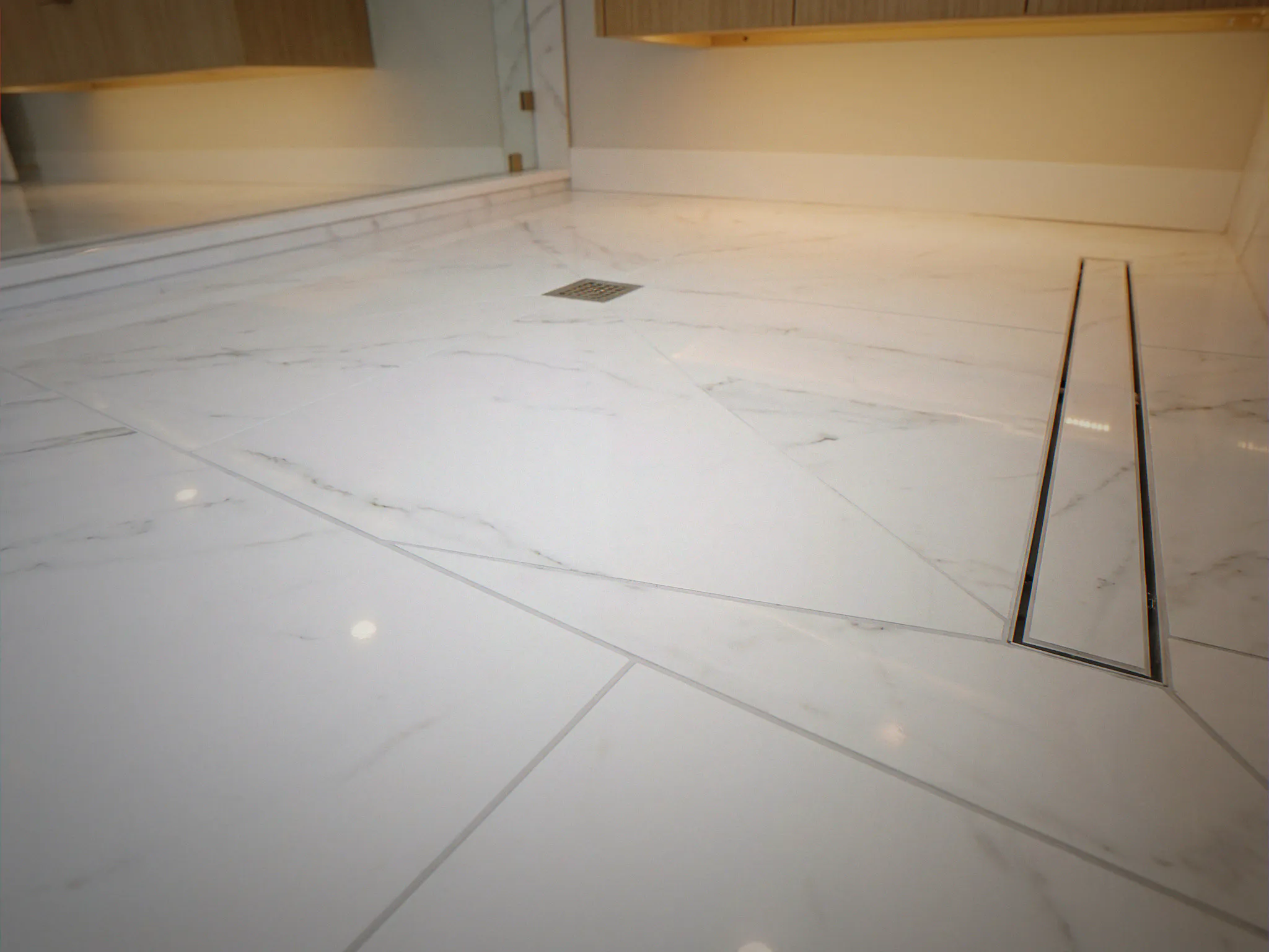 Large-format porcelain floor tile with minimal grout lines — King County, WA