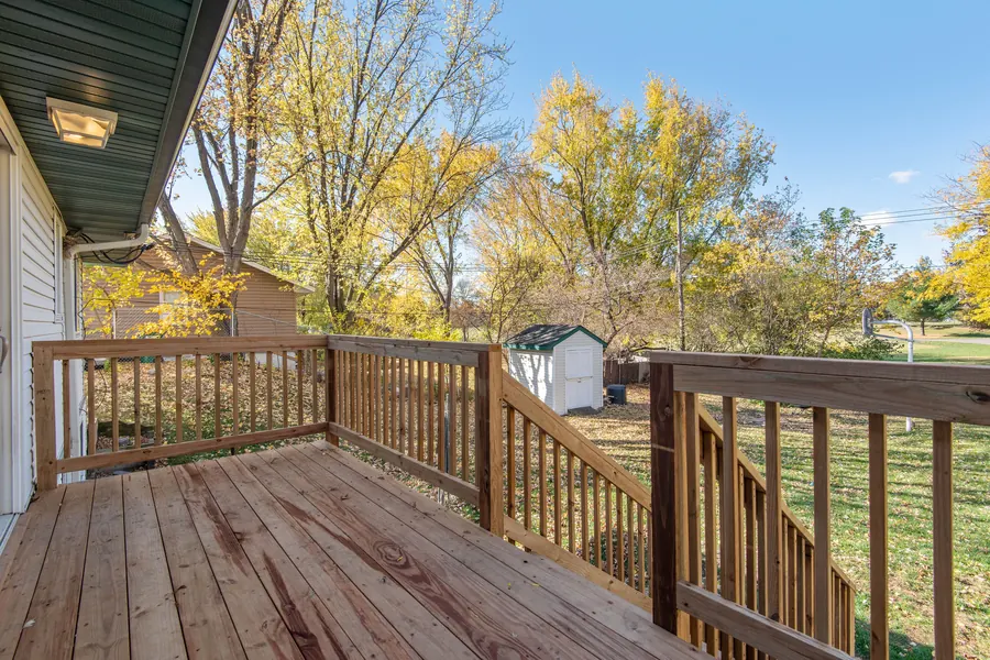 Natural cedar wood deck with railing and backyard view — Washington