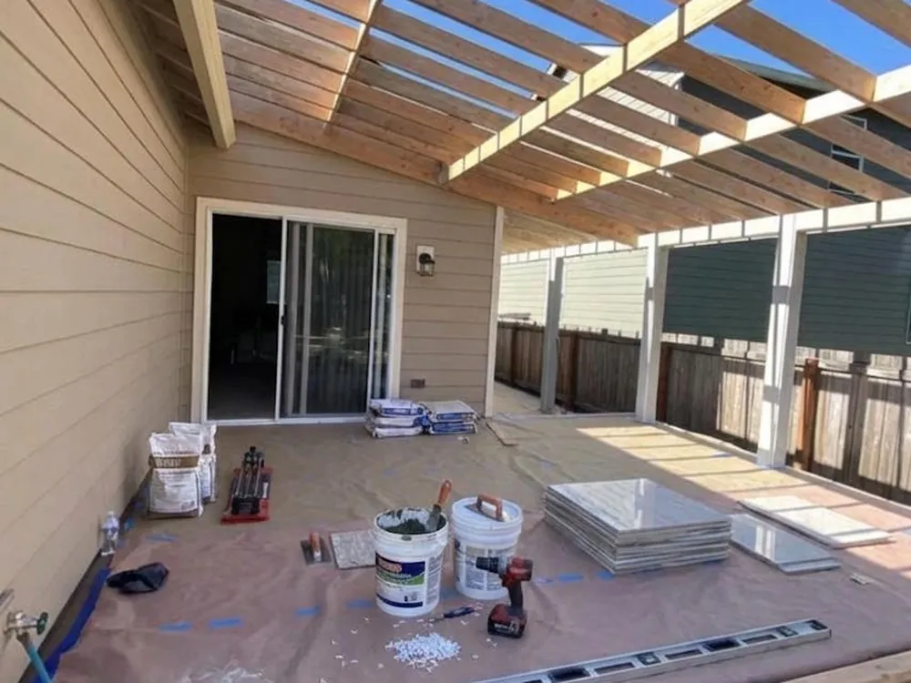 ViOrigin crew framing a covered deck pergola against siding — Lake Tapps, WA