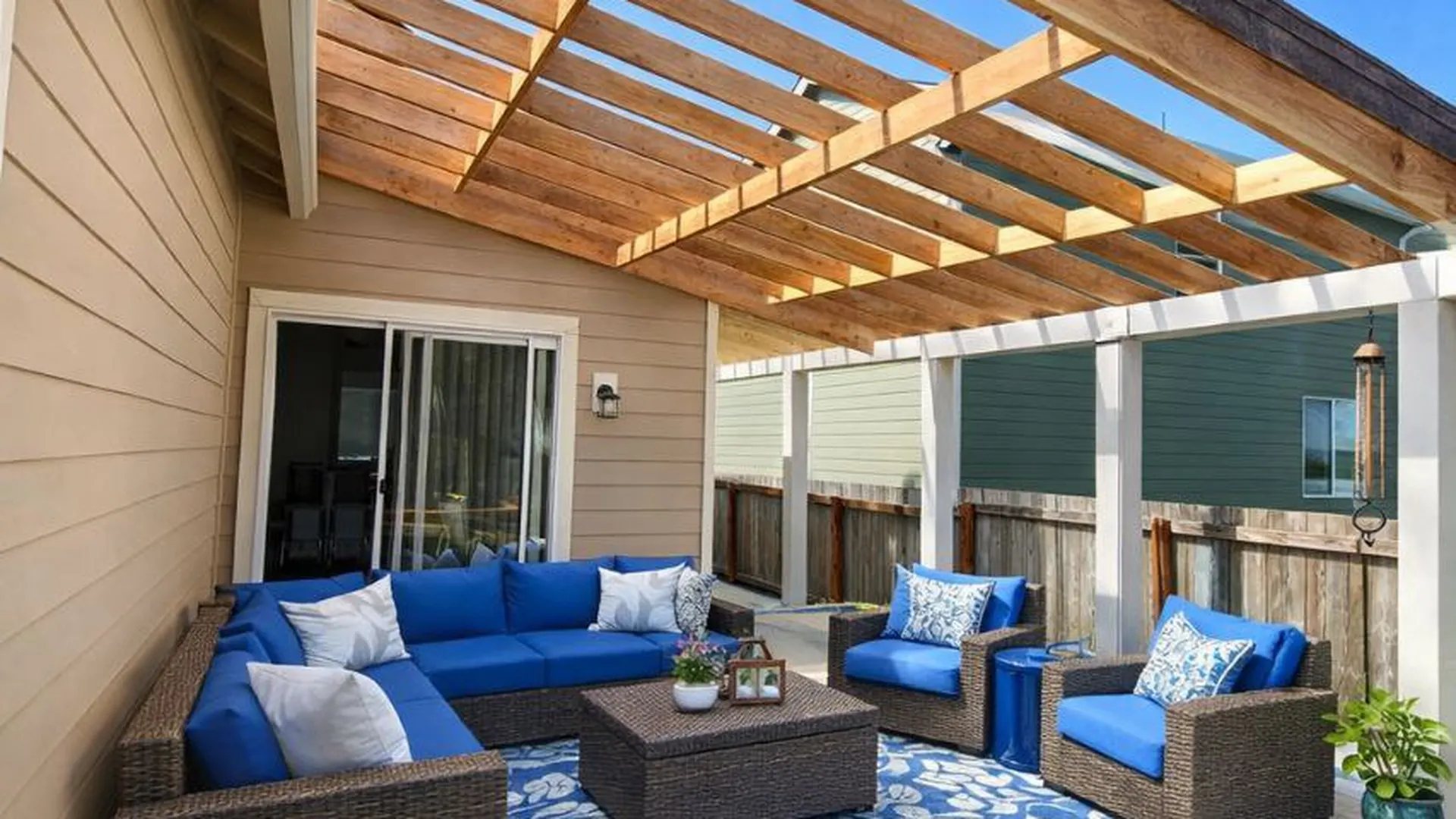 Custom covered deck with cedar pergola and matching exterior siding — Lake Tapps, WA
