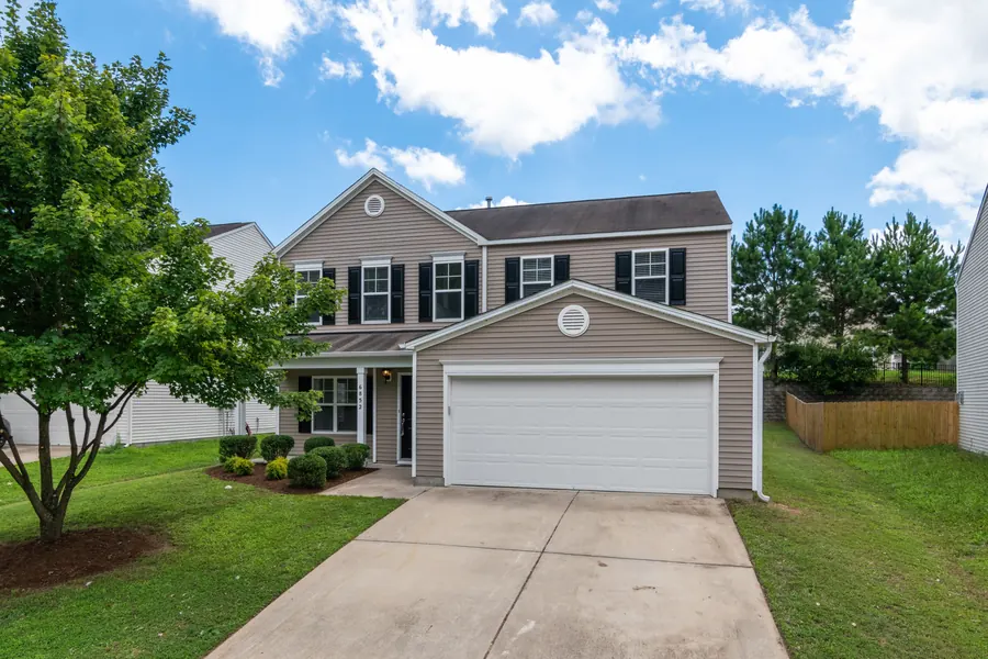 Two-story home with newly installed vinyl siding — Washington